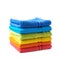 Pile of rainbow colored towels isolated