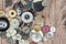 Pile of random colorful shiny sewing buttons isolated on a wood background