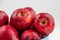 Pile of red appl with clear water drop on  shell surface texture pattern isolated