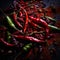 a pile of red and green chili peppers on a black background