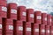 Pile of red oil barrels against blue sky, 3d rendering