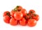 Pile of red tomato bunches over white background