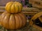 Pile of rumpkin pumpkins small on big close-up with copyspace rustic background