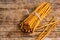 Pile of Salty bread sticks on a wooden table