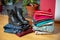 Pile of second hand clothing and shoes on floor