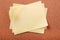 Pile several untidy yellow post notes cork notice board background