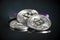 Pile of silver bitcoin cryptocurrency coins with purple digital