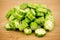 Pile of sliced okra bhindi pieces on rustic wooden background