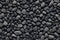 Pile of small pebbles as background texture, top view