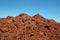 Pile soil or dirt isolated on blue sky background in summer