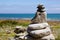 Pile of some pebbles zen balanced stones stack on sea water coast beach