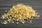 Pile of sprouted green buckwheat on dark wooden table