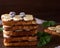 Pile of square fried bread slices with chocolate and banana slices