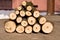 A pile of stacked firewood . A pyramid of round wood