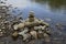 Pile of stones on the river bank