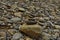 Pile of stones on the river bank