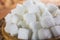 Pile of Sugar Cubes over Wooden Background.