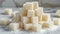 A pile of sugar cubes sitting on top of a table