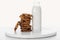 Pile of tasty chocolate cookies near bottle with milk isolated on white.