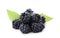 Pile of tasty ripe blackberries with green leaves on white