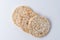 Pile of three rice cakes on white backdrop. Food background