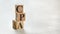 Pile with three wooden cubes - letters CPA meaning COST PER ACTION / ACQUISITION on them, space for more text / images at right