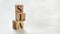 Pile with three wooden cubes - letters SLA meaning Service Level Agreement on them, space for more text / images at right side