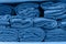 pile of towel arranging in layer in classic blue trendy color. background. Color of the year 2020