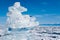 A pile of transparent ice floes on the surface of the frozen, largest fresh Lake Baikal in winter. Siberia.