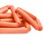 Pile of the uncooked frankfurters in the synthetic casing closeup