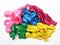 Pile of uninflated balloons from different colors