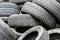 The pile of used automobile tires in the junkyard