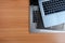 Pile of used laptops computer, on wooden background.Top view copy space