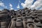 Pile of used tires. Old and unsafe car tires