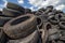 Pile of used tires. Old and unsafe car tires