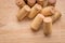 Pile of used vine corks on wooden background with copy space