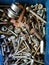 Pile of variety old and new stainless bolt, nut, ring, nail