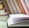 Pile of various books on wooden background