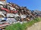 Pile of various scrap cars and other metals on a junk yard ready recycling industry.