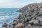 Pile of volcanic stones on the coast of the Atlantic Ocean in Santa Cruz