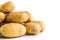 A pile washed potatoes isolated on white.