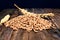 Pile of wheat grain on the rustic wooden table