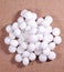 A pile of white naphthalene balls.