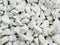 Pile  of white naturale   cracked  stones used to decorate the garden or parts of the house indoor or outdoor