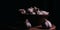 Pile of whole bulbs of garlic in ceramic bowl on table. Harvest of unpeeled vegetables on black background.