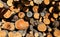 pile of wood with large logs cut by loggers in the mountains