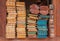 Pile of wood stored in stock on shelf.