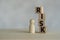 Pile wooden cubes of RISK text placed near wooden figures peg doll, Risk assessment, decision to accept business result in