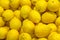 A pile of yellow lemons background, texture