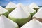 pile young coconut on the beach background